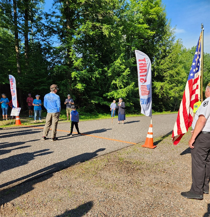 Betty Schneider leading National Anthem